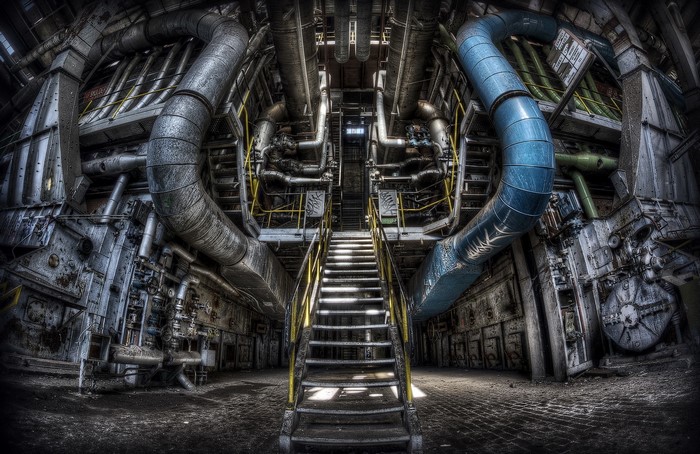 Industrial Factory Interior with Large Pipes and Stairs