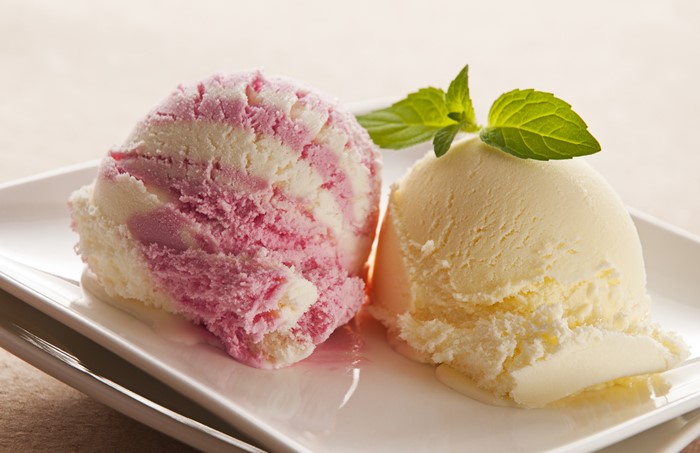Two scoops of ice cream with mint
