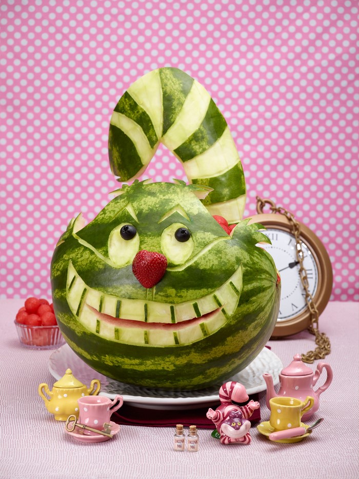 Cheshire Cat watermelon carving with Alice in Wonderland tea set