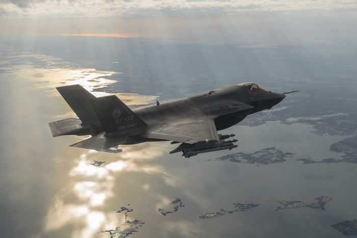F-35B Lightning II aircraft flies over water