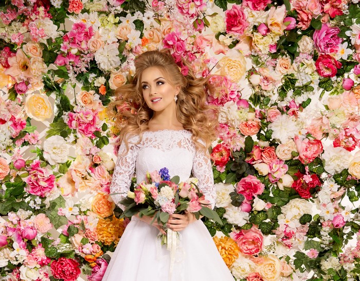Bride with Bouquet in Flower Wall
