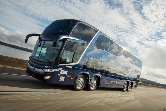 Blue double-decker Mercedes-Benz bus on a highway