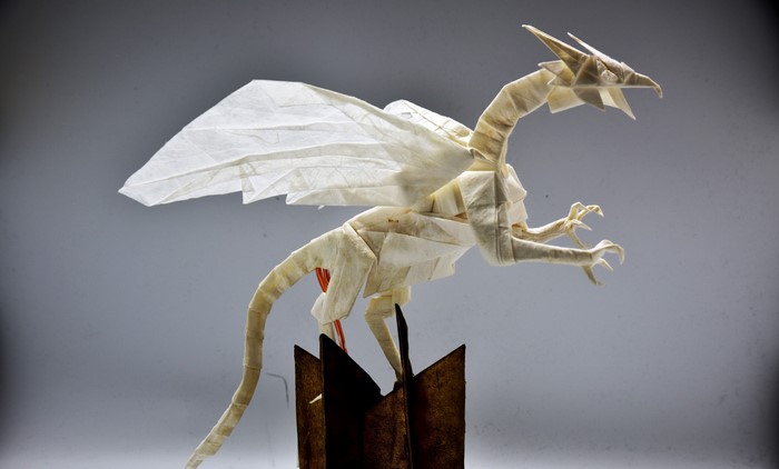 Origami dragon on a stand