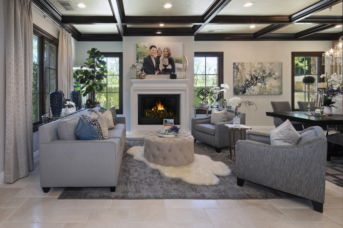 Living room with fireplace, sofa, and armchairs