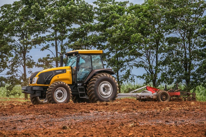 Valtra BM125i tractor plowing a field