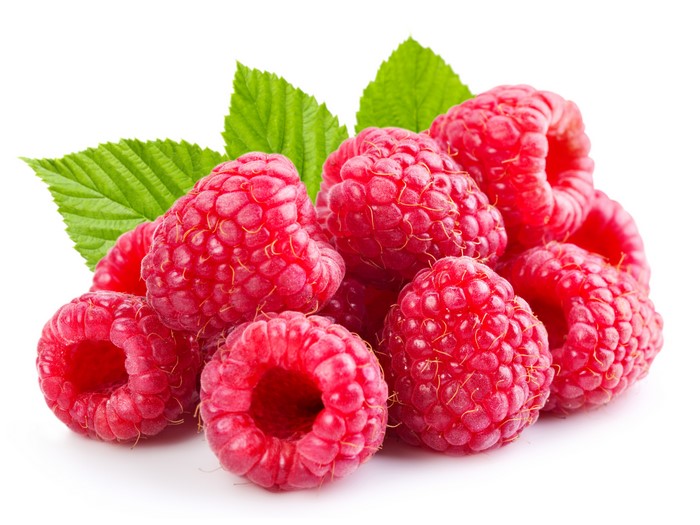 Raspberries with green leaves on white background