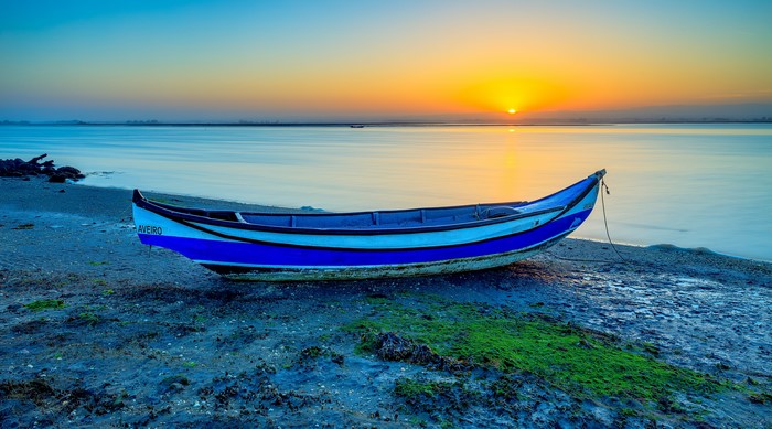Boat on the shore at sunrise