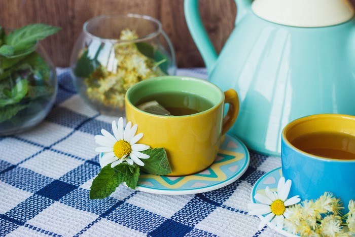 Tea cups with chamomile and mint