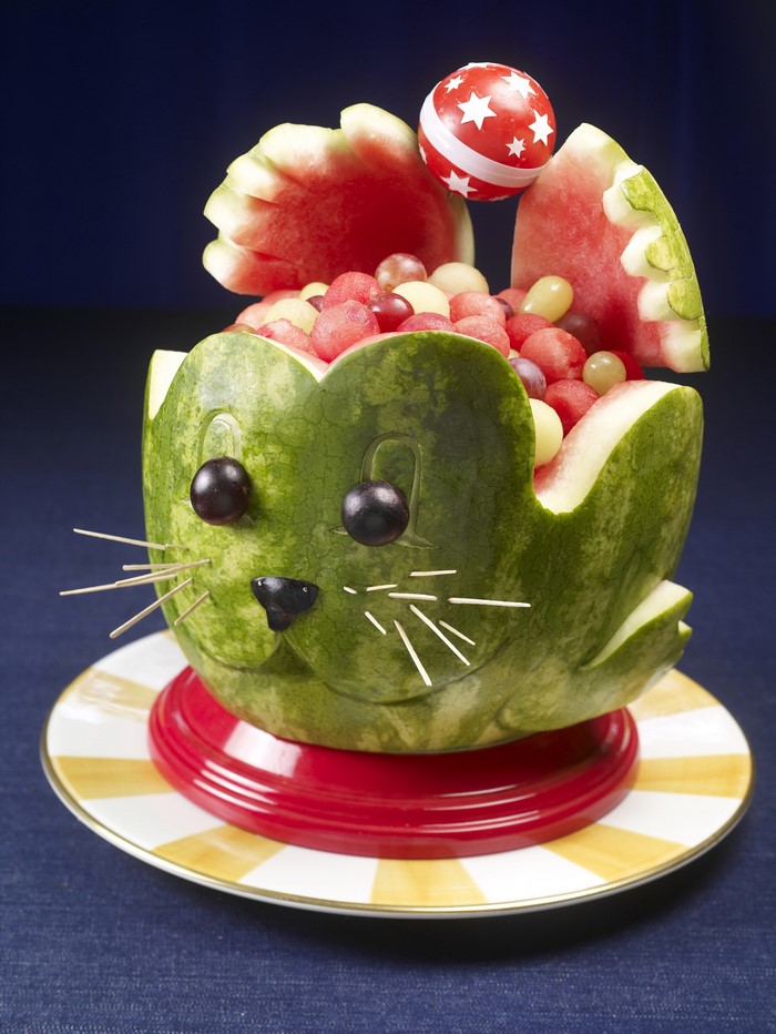 Watermelon carved into a cat filled with fruit