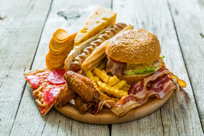 Fast food assortment on wooden planks