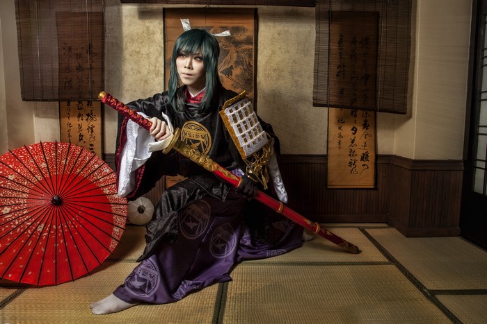 Samurai warrior with katana and red umbrella