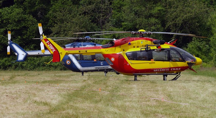 Two Eurocopter EC-145 Helicopters on Grass