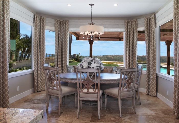 Dining Room Table and Chairs with Chandelier and Curtains