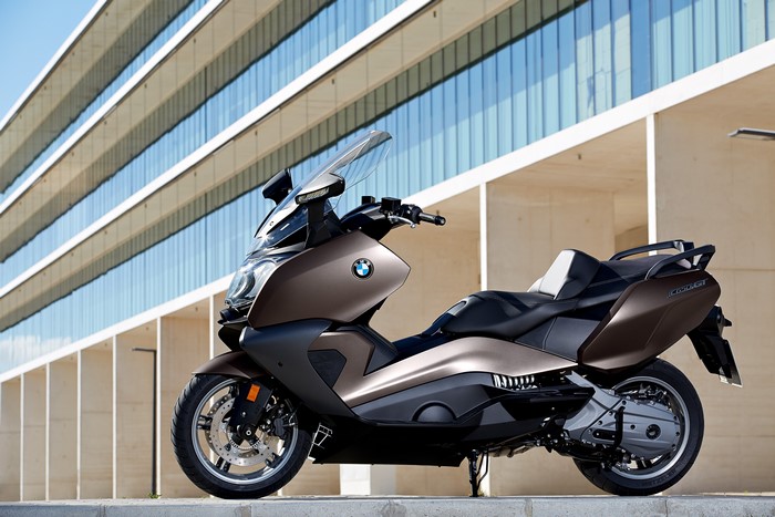 BMW C 650 GT scooter parked in front of a modern building