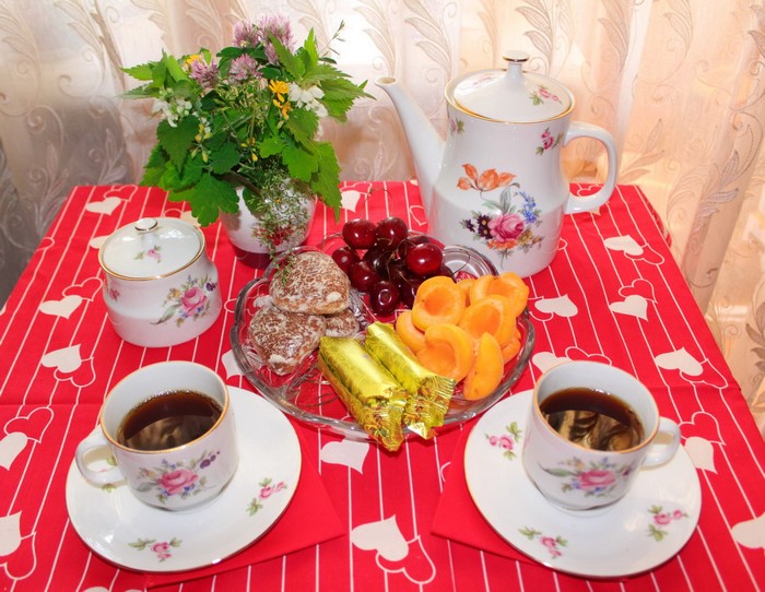 Table setting with tea, cookies, and fruit