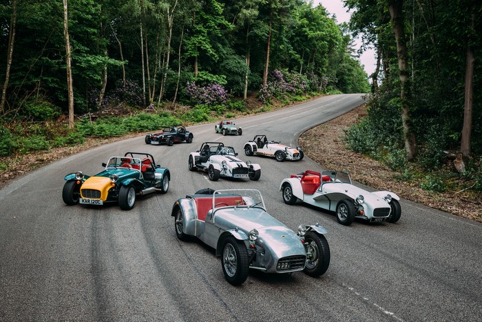 Multiple Caterham 7 cars on a winding road