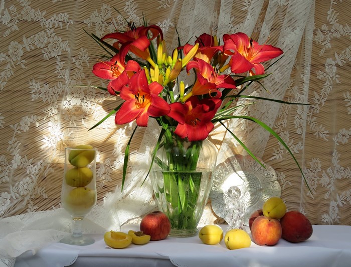 Still-life with lilies, peaches, and apples in a vase