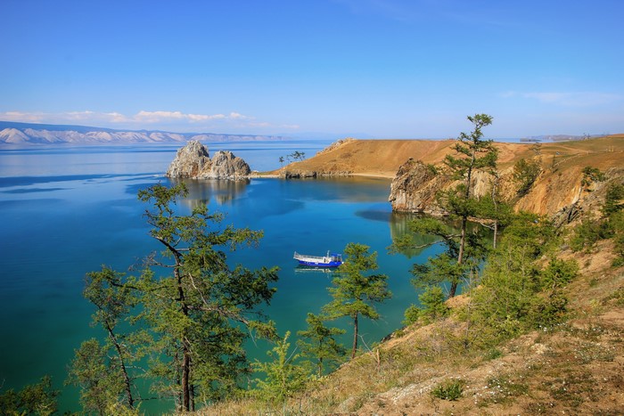 Lake Baikal with Shamanka Rock and a boat