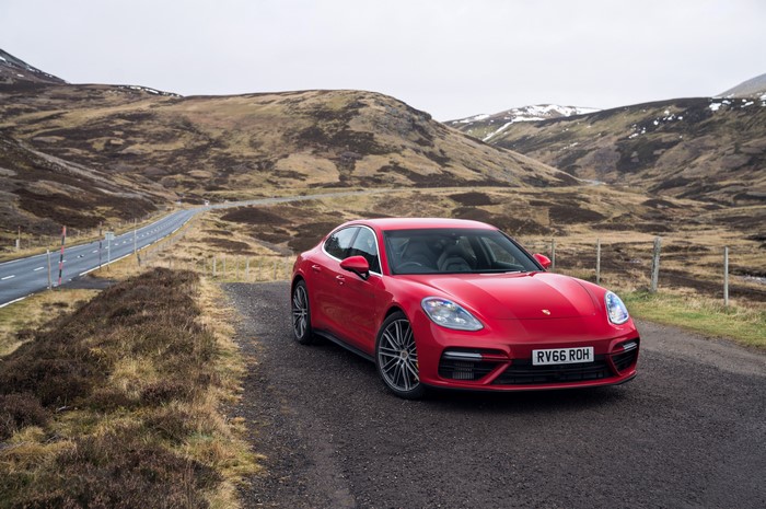 Red 2016 Porsche Panamera Turbo on a road
