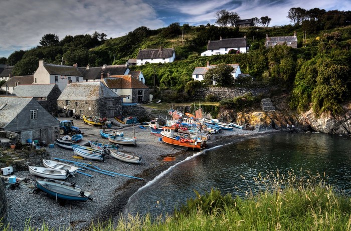 Fishing village with boats on the coast of Cornwall, England