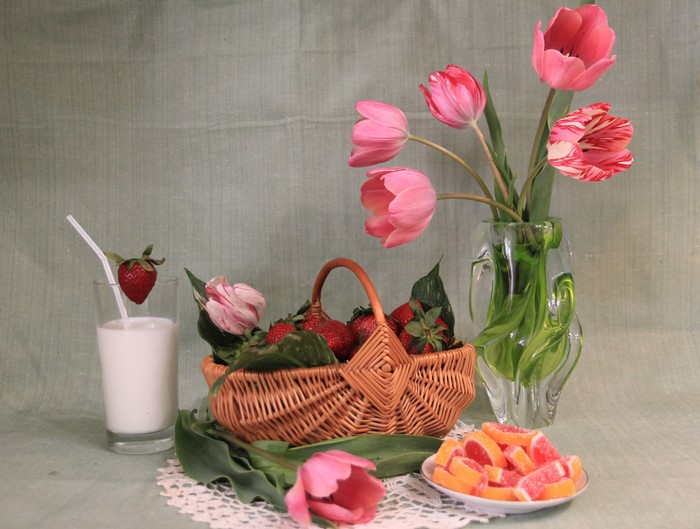 Still-life with tulips, strawberries, milk, marmalade, and a wicker basket