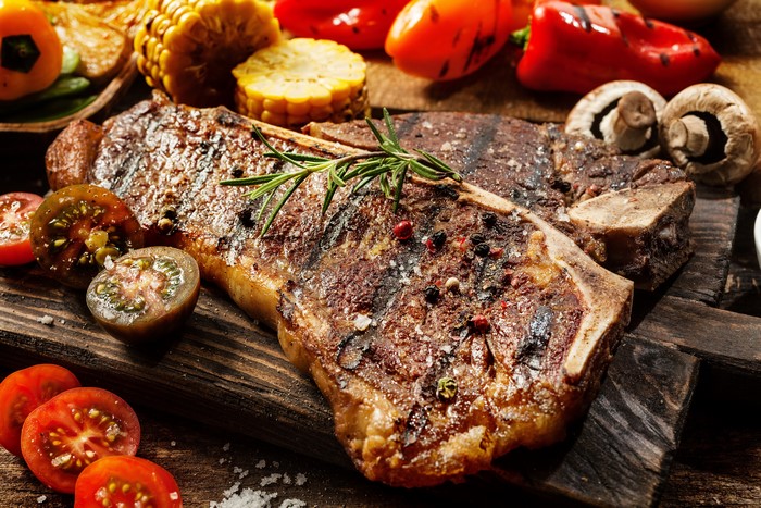 Grilled T-bone steak with vegetables