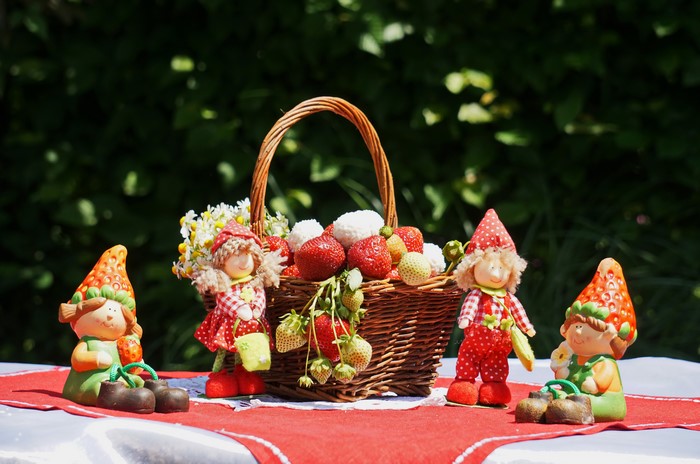 Strawberry dolls and basket with strawberries