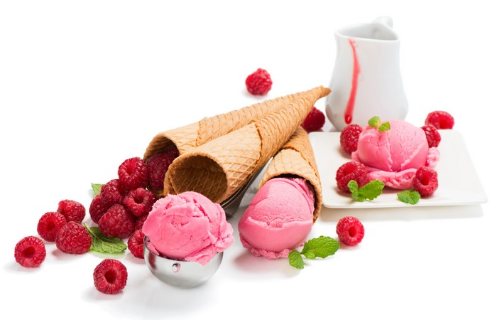 Raspberry ice cream in cones with fresh raspberries