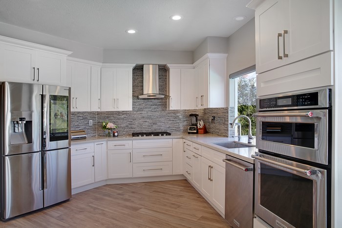Modern White Kitchen with Stainless Steel Appliances