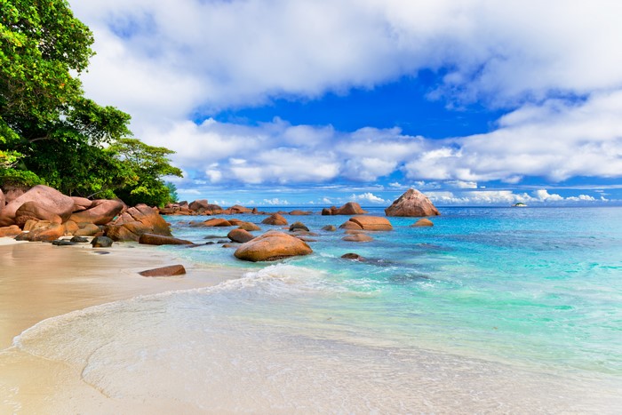 Tropical beach with granite boulders and turquoise water