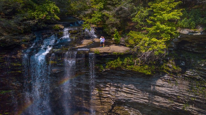 Couple standing on rocks at Piney Falls, Tennessee