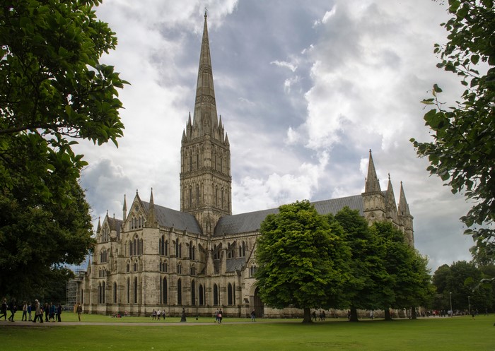 Salisbury Cathedral, England, with trees and lawn