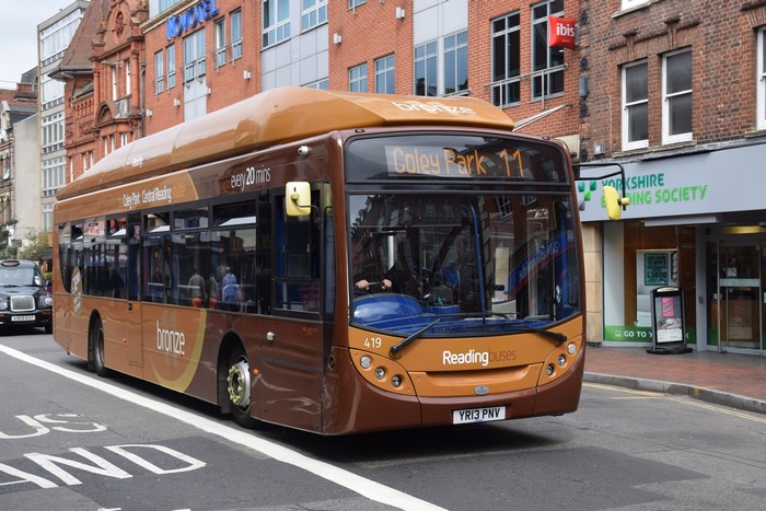Brown Reading Buses bus on a street