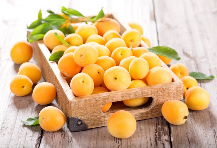 Many Apricots in a Wooden Crate