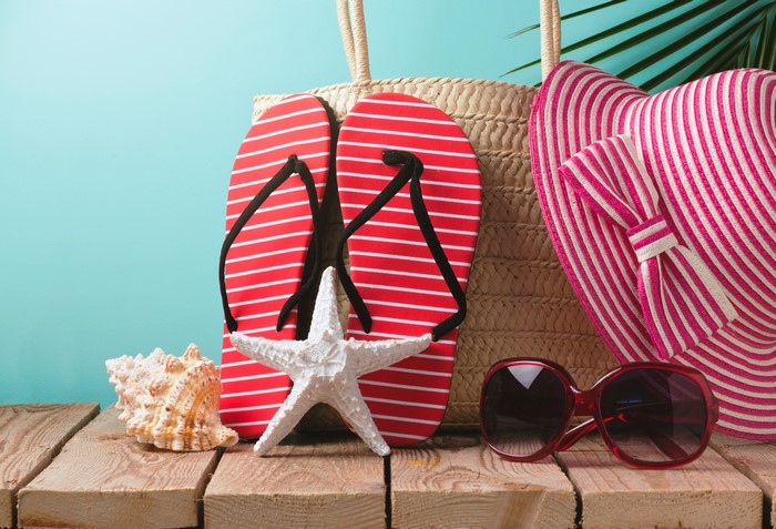 Summer beach accessories on wooden planks