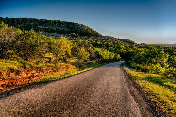 Road through a hilly landscape in Llano, Texas