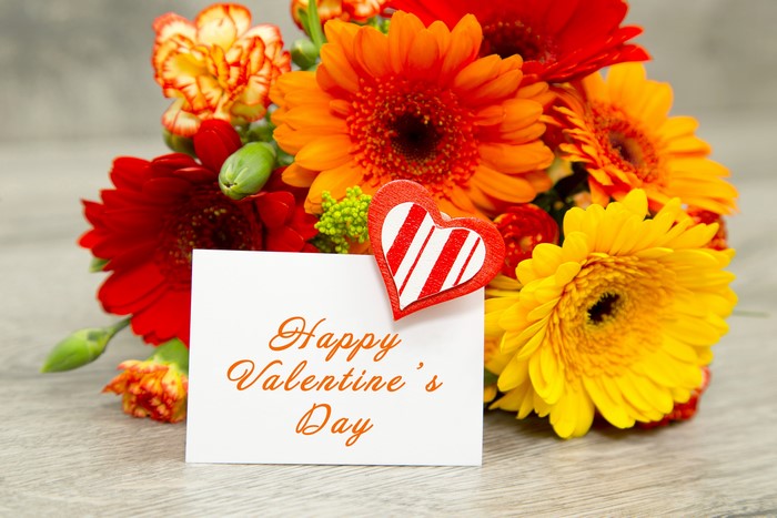 Happy Valentine's Day flowers with a heart ornament