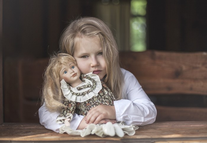 Girl holding a doll