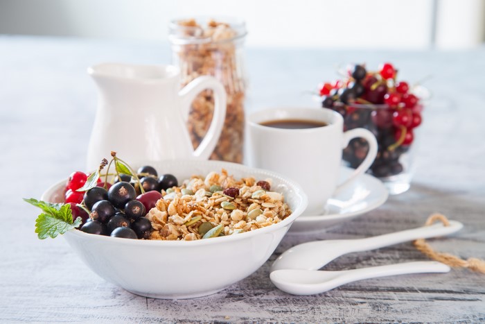 Breakfast with Muesli, Berries, Coffee, and Milk