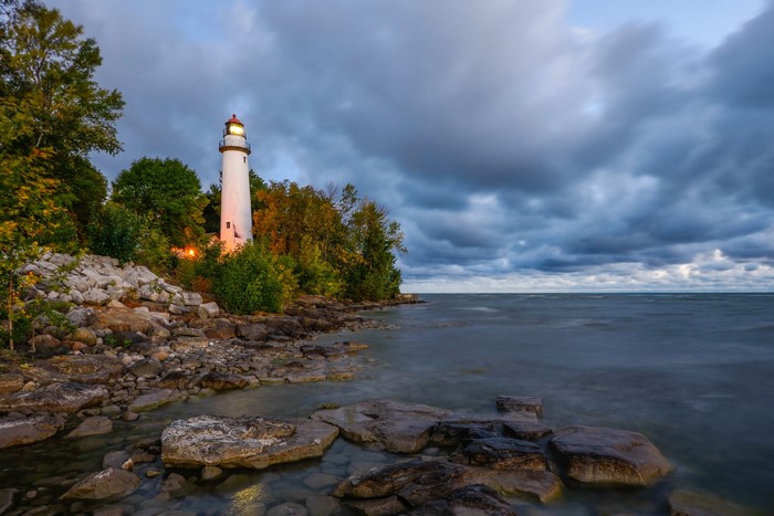 Pointe Aux Barques Lighthouse on a rocky coast