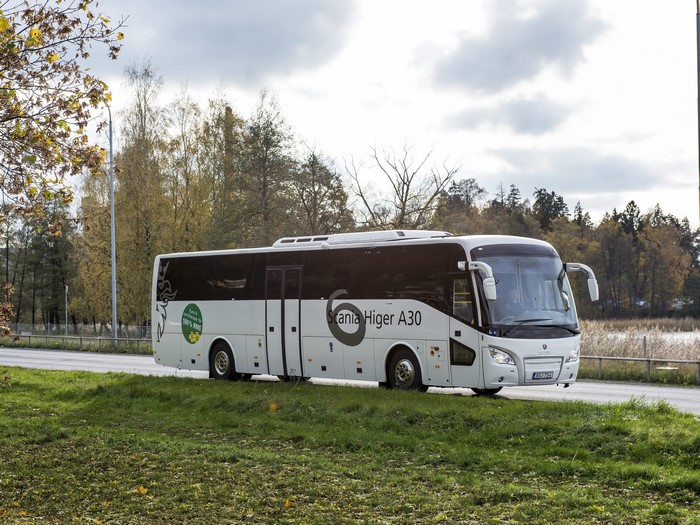 White Scania Higer A30 bus on a road