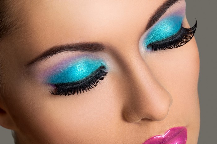 Close-up of woman's eyes with vibrant makeup
