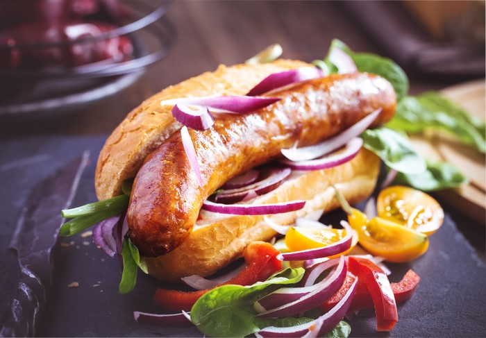 Hot dog with sausage and vegetables