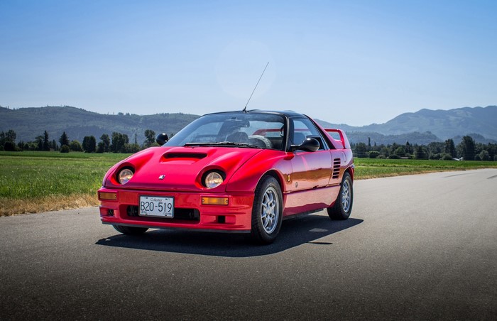 Red Autozam AZ-1 Sports Car on Road