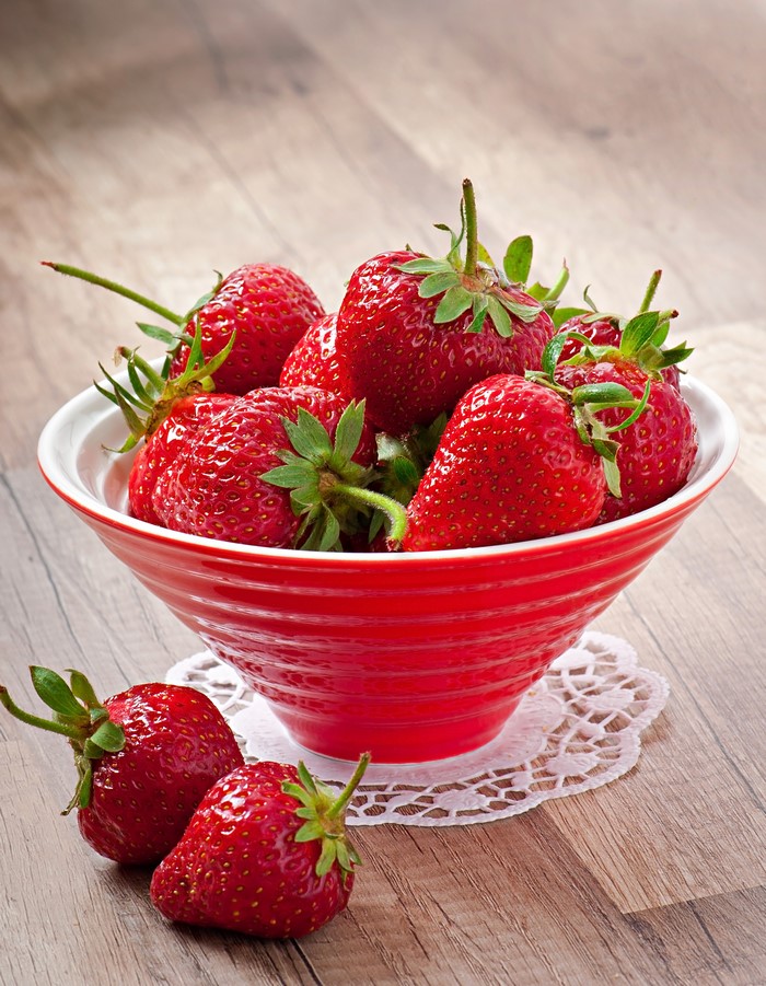 Strawberries in a red bowl