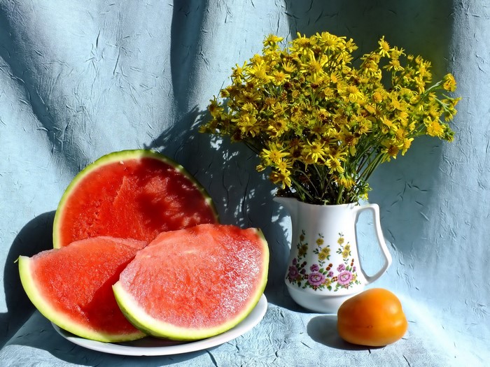 Still life with watermelons, flowers, and tomato