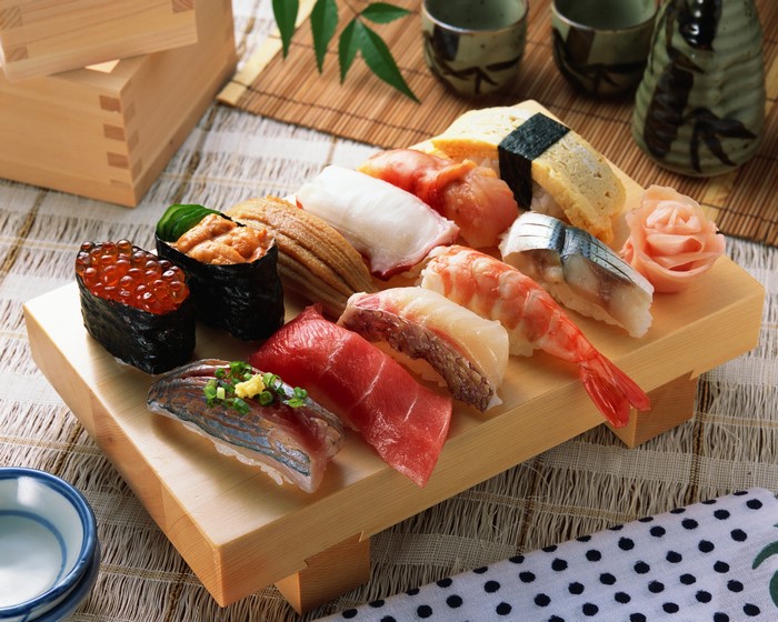Assortment of sushi on a wooden platter