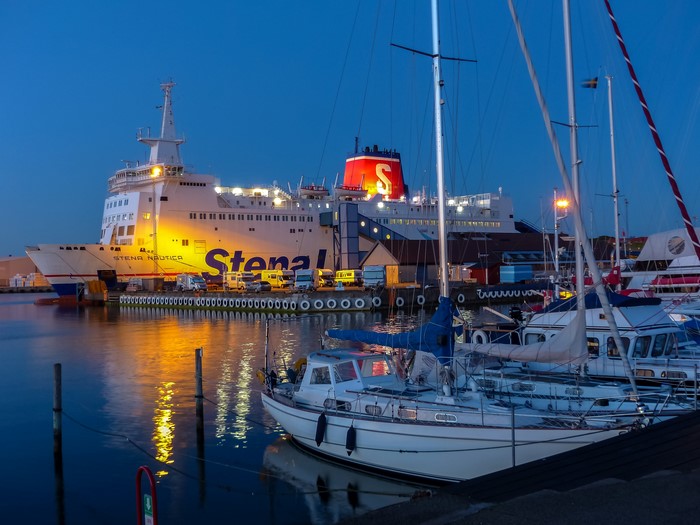 Stena Nautica ferry and sailboats in Varberg marina at dusk