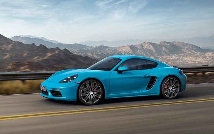 Light Blue Porsche Cayman in Motion
