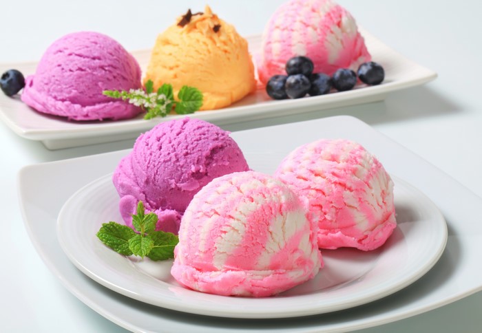 Ice cream scoops with blueberries and mint